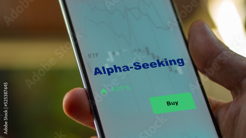 An investor's analyzing the alpha seeking etf fund on screen. A phone shows the ETF's prices sandp 500 short term to invest