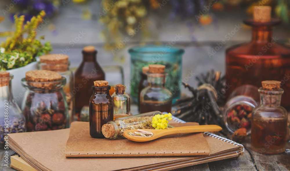 Medicinal herbs and tinctures homeopathy. Selective focus. Medicinal herbs and tinctures homeopathy. Selective focus.