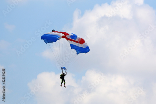  Skydiver flying wing in a blue sky 