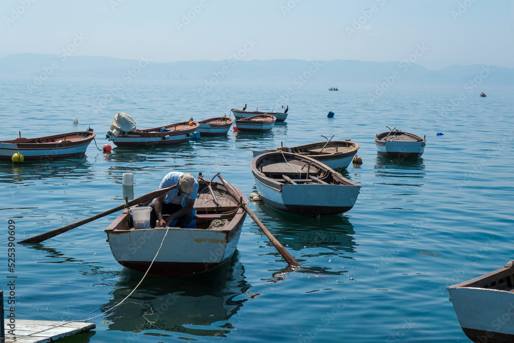 Small fishing boats on the sea. A lot of small fishing boats and azure sky scenery.Sea and boat concept.
