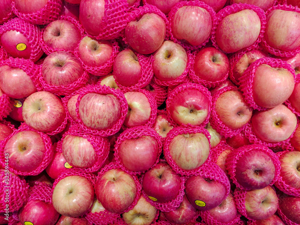 Stack of apples with protective foam for fruits Stack of apples with protective foam for fruits