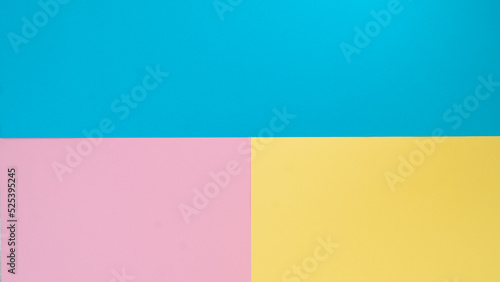Background three colors of paper - blue, yellow, pink