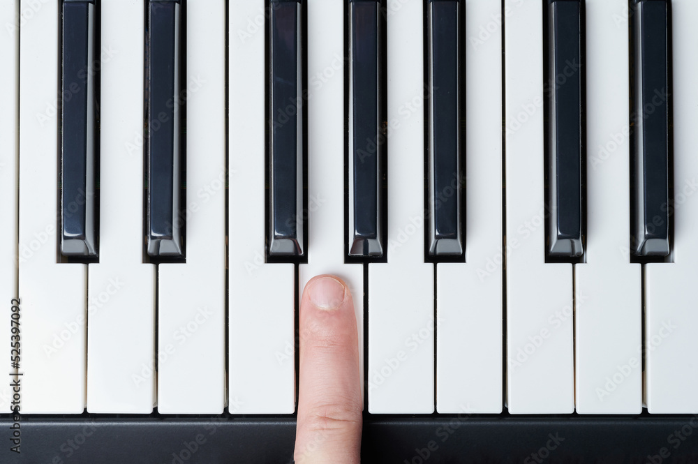 Naklejka premium Push white piano key