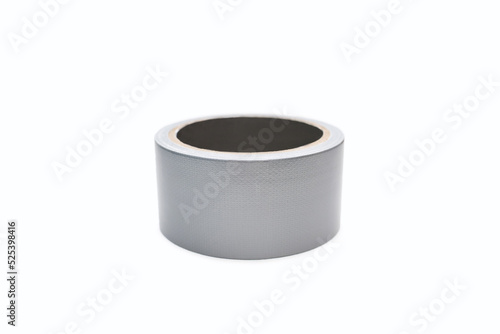 Roll of gray adhesive tape on a white background. Adhesive tape for repair work and cable communications. Adhesive tape for moisture protection or for assembly and packaging