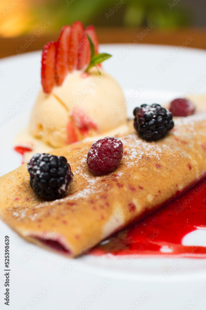 Crepe pancakes with strawberries and ice cream Crepe pancakes with strawberries and ice cream