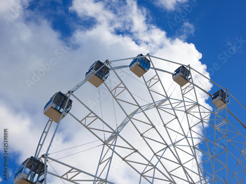 Ferris wheel ride with clouds
