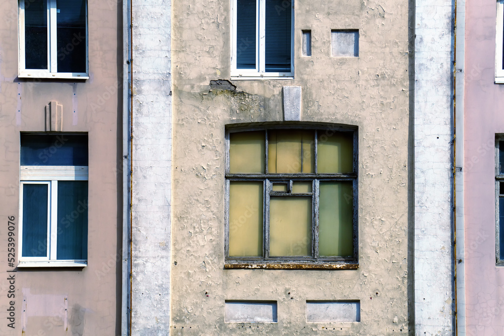 The old window in the building is boarded up with wooden sheets from the inside The old window in the building is boarded up with wooden sheets from the inside