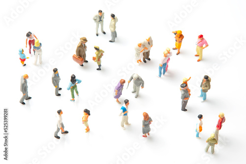 miniature people. different people stand on a white background. communication of society of different generations