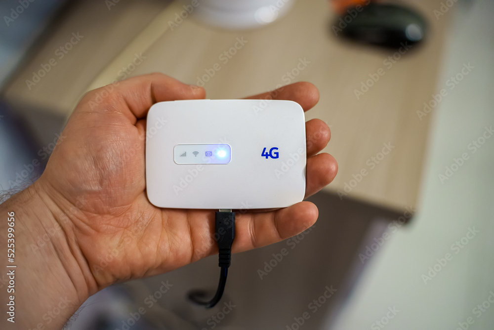 Modern wireless pocket 4g wifi modem. foto de Stock | Adobe Stock