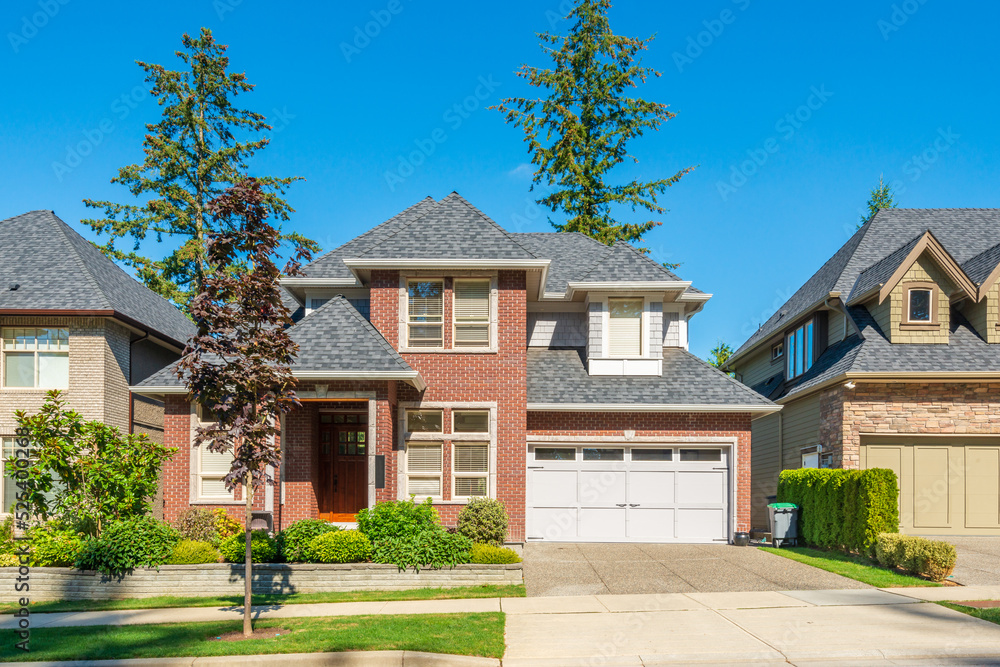 A perfect neighbourhood. Houses in suburb at Summer in the north America. Luxury houses with nice landscape. A perfect neighbourhood. Houses in suburb at Summer in the north America. Luxury houses with nice landscape.
