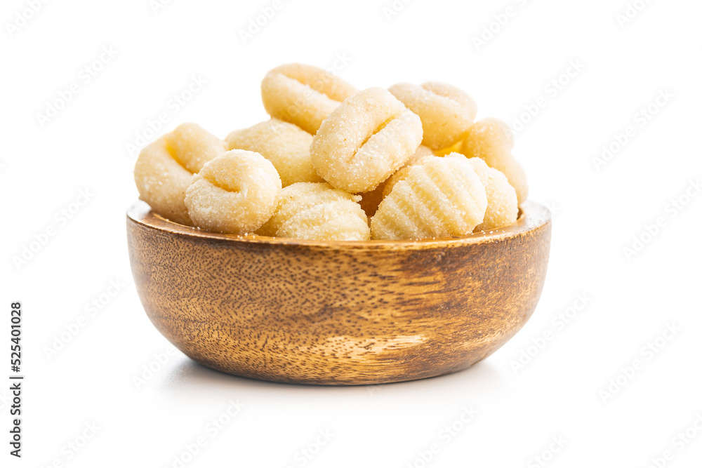Uncooked potato gnocchi in bowl isolated on white background. Uncooked potato gnocchi in bowl isolated on white background.
