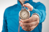 mechanical stopwatch in hand. Time part precision. Measuring the speed interval with a watch