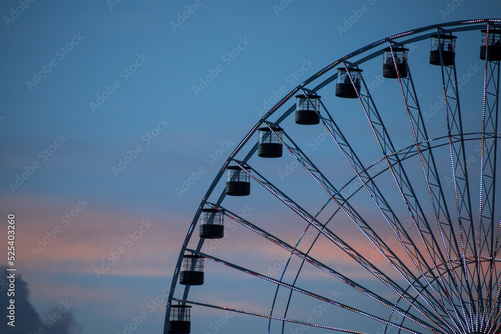 High ferris wheel in a cloudy summer sunset High ferris wheel in a cloudy summer sunset
