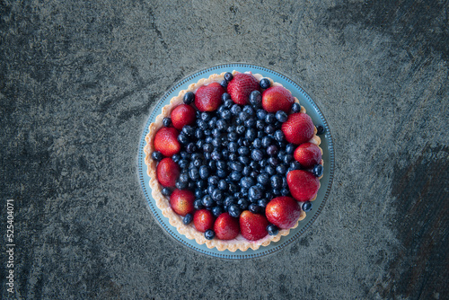 Cake with blueberries and strawberries. View from above 