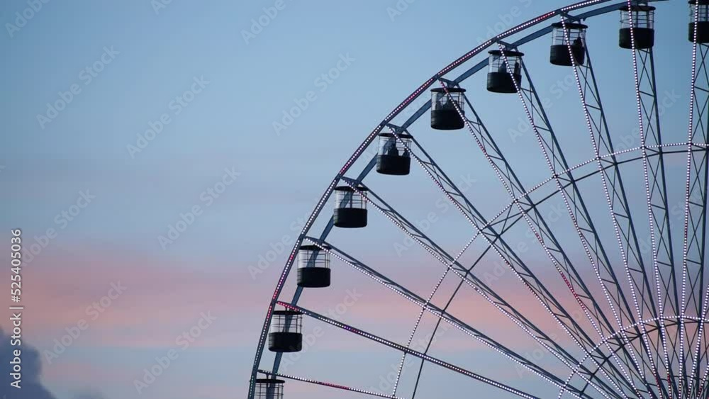 High ferris wheel in a cloudy summer sunset High ferris wheel in a cloudy summer sunset