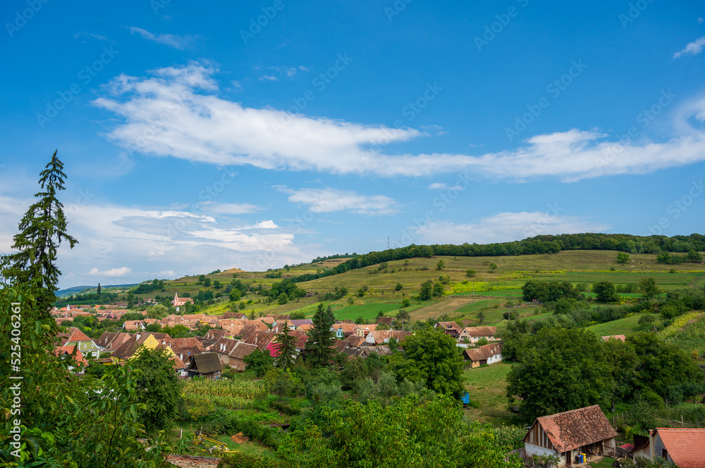 view of an old village in the hills during summer view of an old village in the hills during summer