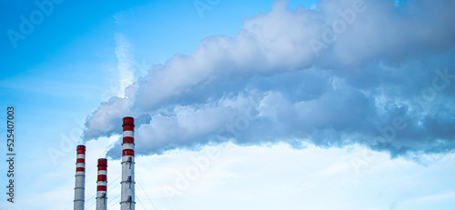 Принти на полотні Air pollution. Smoking chimneys against blue sky.