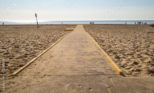 фотографія Wooden boardwalk across the sandy beach in the seaside town of Lowestoft on the