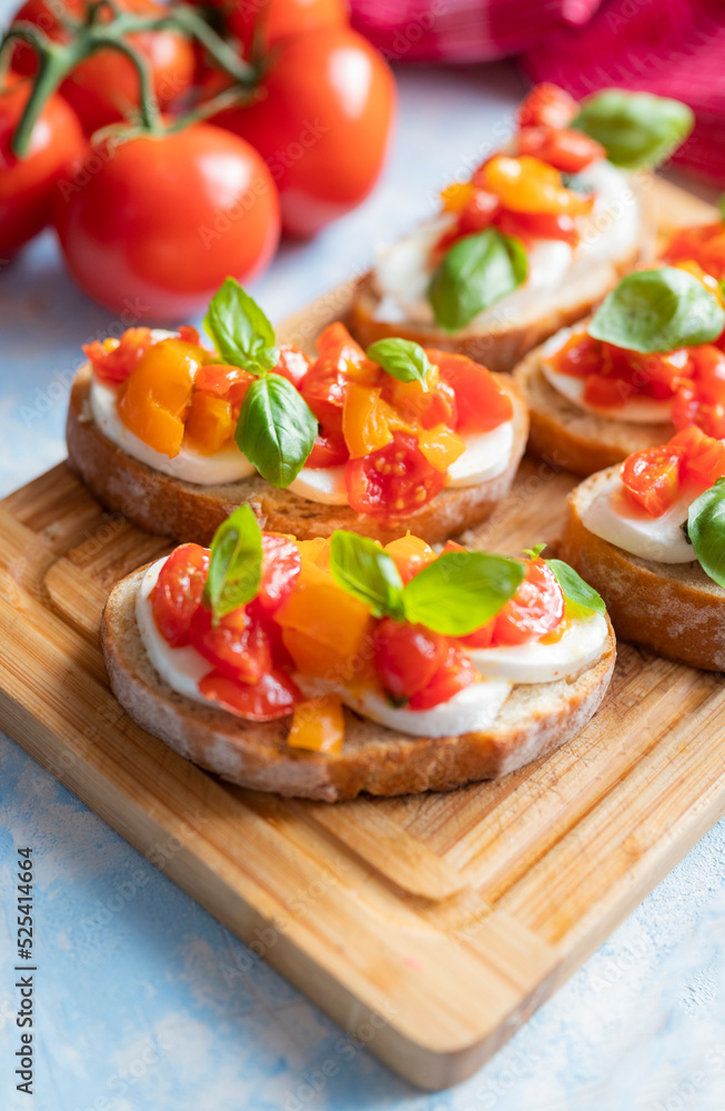 crispy bruschetta bread with mozzarella cheese with tomatoes and basil