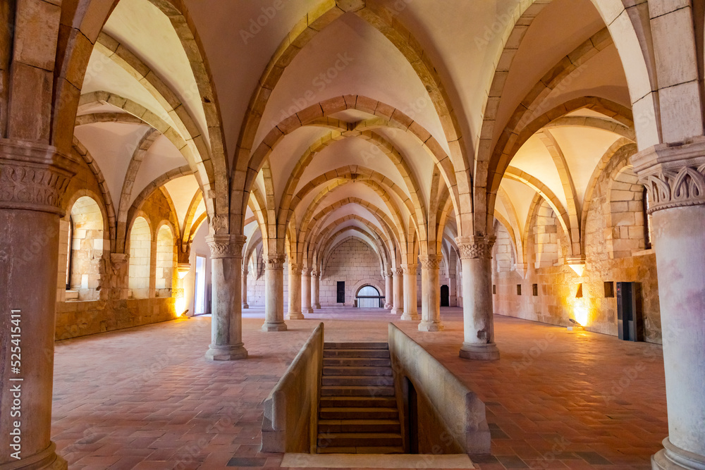 The empty hall of the canteen with the columns and the vaulted ceiling in the monastery of Alcobaca, Portugal