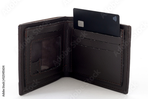 brown leather wallet and black credit card close-up on white background