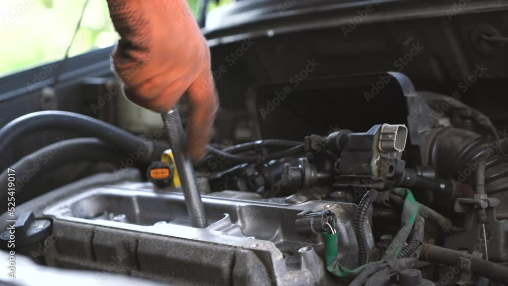 auto mechanic repairs sedan auto. close-up auto mechanic repairs sedan auto. close-up