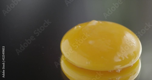The yolk falls on a mirror surface