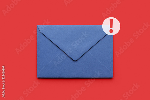 Paper envelope with urgent message on red background