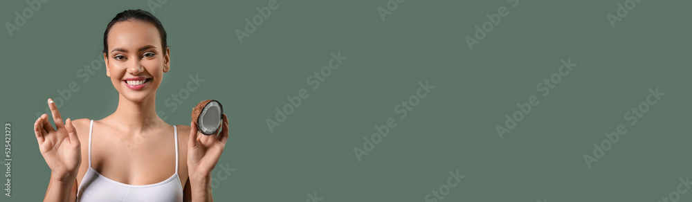 Pretty young woman with coconut and cream on green background with space for text Pretty young woman with coconut and cream on green background with space for text