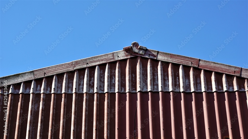 asbestos warehouse roof against blue sky asbestos warehouse roof against blue sky