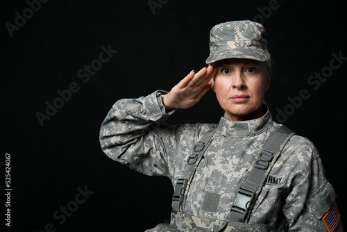 Mature female soldier salut...