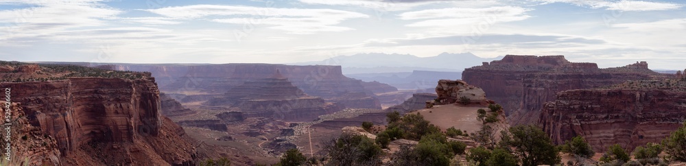 Scenic Panoramic View of American Landscape and Red Rock Mountains in Desert Canyon. Cloudy Sky. Canyonlands National Park. Utah, United States. Nature Background Panorama