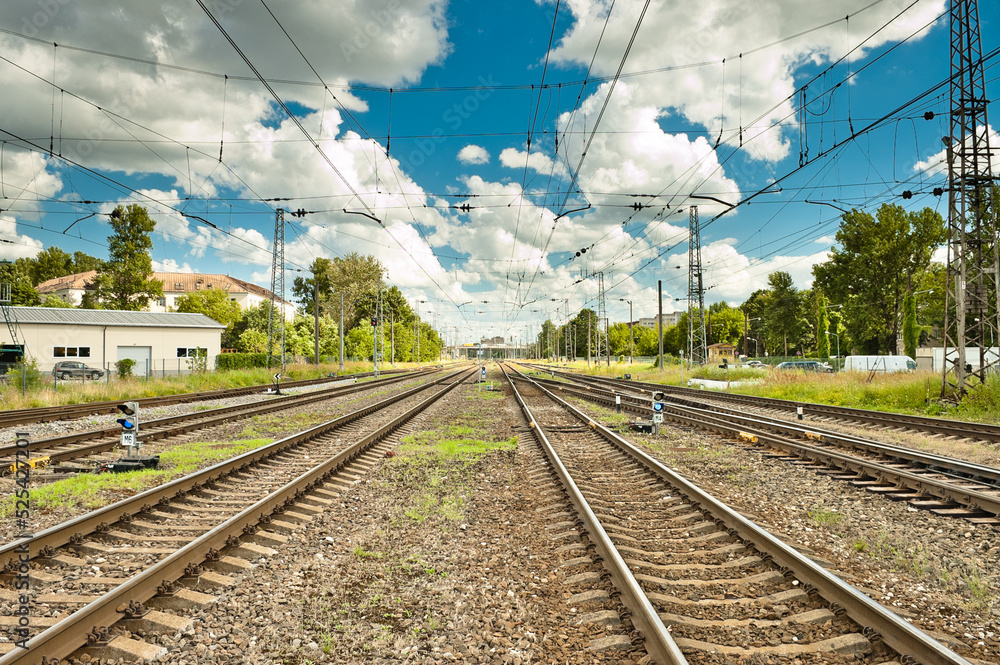 Naklejka premium railway against the blue sky and clouds