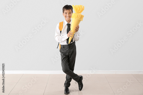 Little boy with yellow scho...