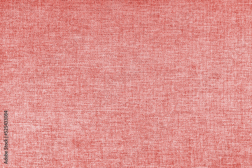 Texture of natural red upholstery fabric or cloth. Fabric texture of natural cotton or linen textile material. Blue canvas background. Decorative fabric for curtain, furniture, walls, clothes
