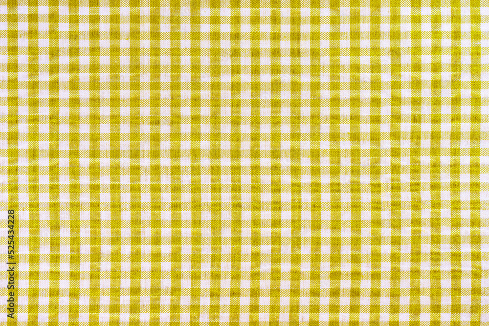 Yellow classic checkered tablecloth texture, background with copy space
