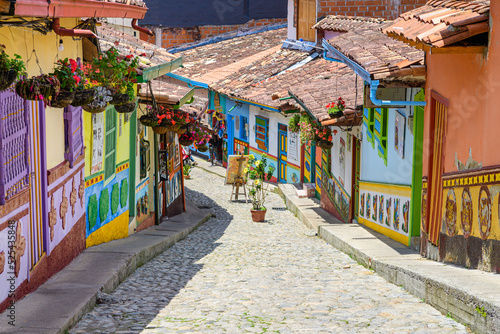 colorful street of guatape colonial town, colombia © jon_chica