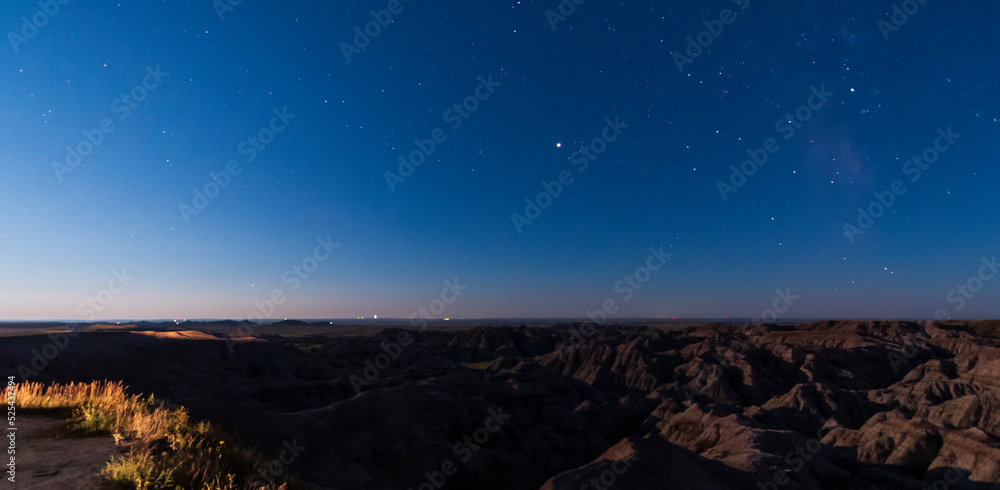 rugged rock formations under the  clear night stars in Badlands national park in South Dakota