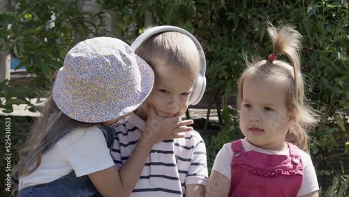 Portrait of Cute Little Three Children With Headphones Listening to Music. Cheerful Carefree Childhood. Preschool Siblings Friends Feeling Free Funky, Good Emotions Life. Home Dancing. Friendship Kids photo