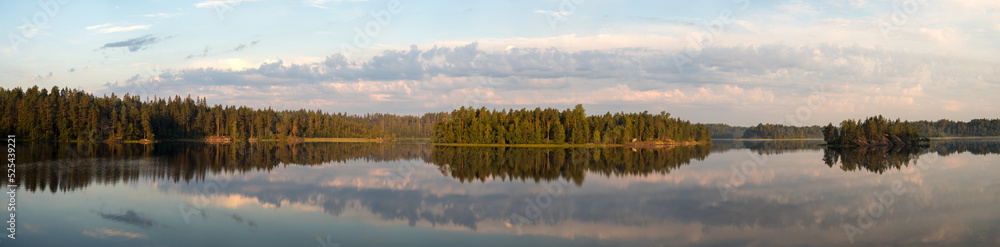 forest lake with clouds on a summer day