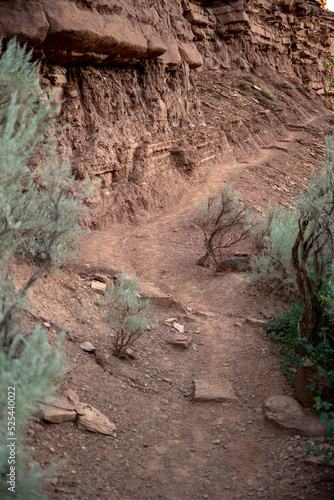 Wallpaper Mural Faint Trail Leads Along Rocky Desert Cliff Torontodigital.ca