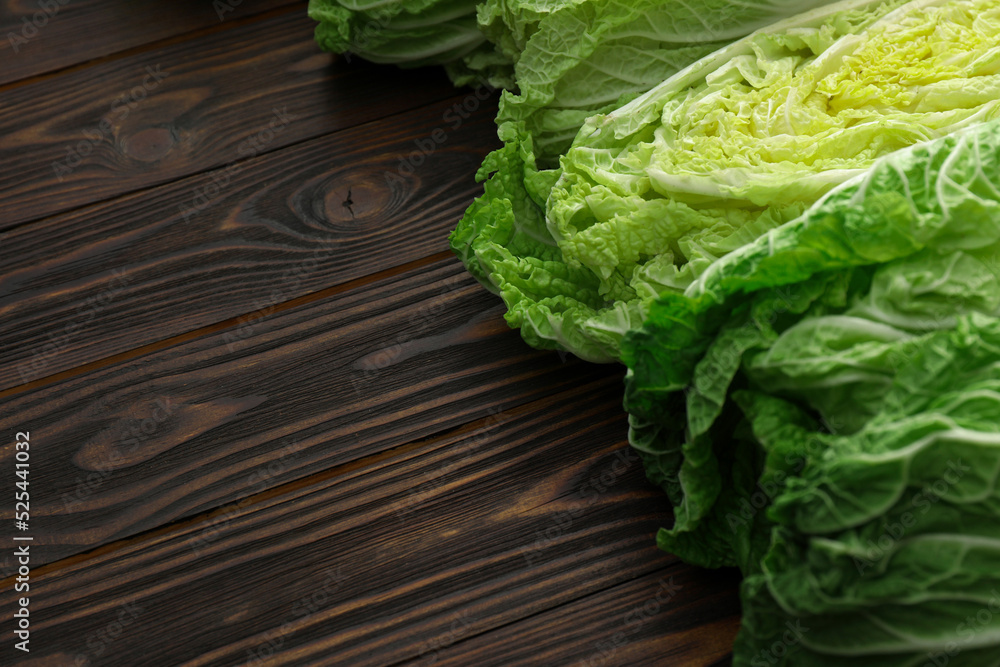Fresh ripe Chinese cabbages on wooden table, closeup. Space for text Fresh ripe Chinese cabbages on wooden table, closeup. Space for text