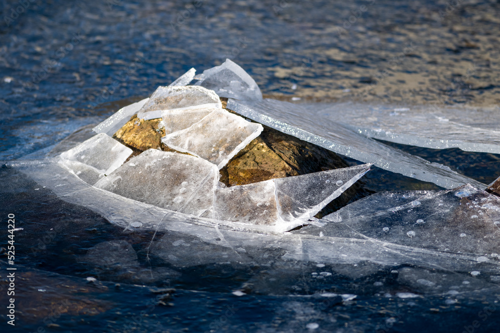 Bumpy Ice Ice formed on the top of a freshwater pond. The solid water has bumps ...