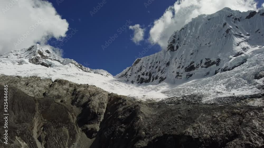 Aerial view of a snowy hillside with mountains in the background on a sunny day in the Andes Aerial view of a snowy hillside with mountains in the background on a sunny day in the Andes