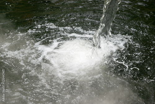Fountain waterfall with clear splashing bubbling water