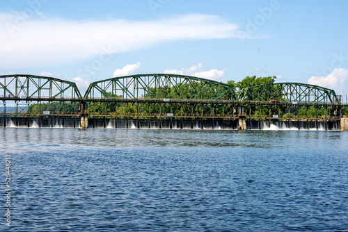 Obraz na płótnie Rotterdam, NY – USA - Aug 5, 2022 Horizontal View of The Movable Dam at Lock 8, a three-span moveable dam with a walkway across the Mohawk River. Part of the Erie Canal and York State Barge Canal. w salonie