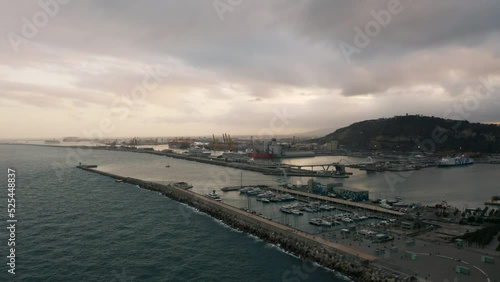 Wallpaper Mural Aerial view around the Marina Vela Barcelona harbor, cloudy sunrise in Spain - circling, drone shot Torontodigital.ca