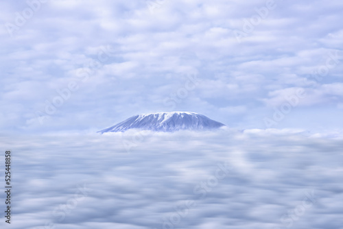 Mount Kilimanjaro peak over rainy cloud  in Tanzania view from Amboseli National Park Kenya © Mongkolchon