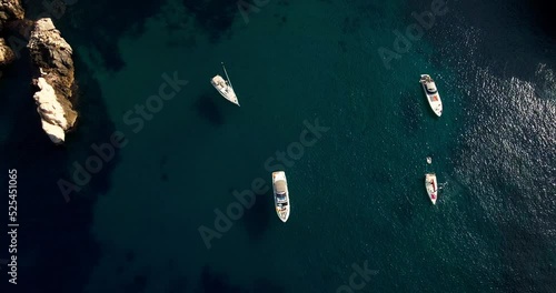 Luxury yachts and speedboats in exclusive Spanish cove with beautiful clear turquoise water  photo