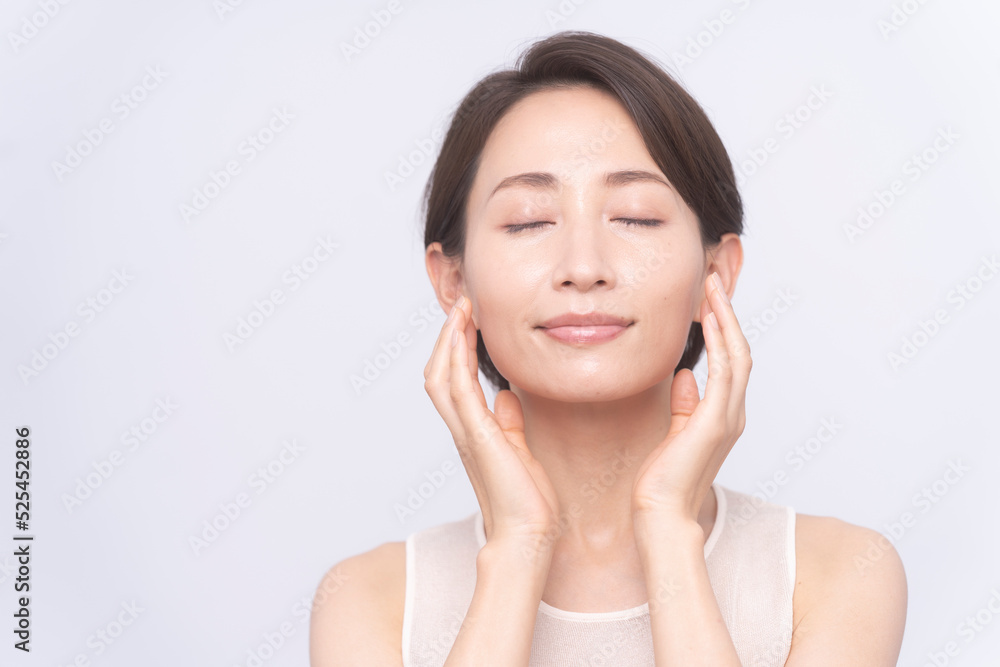 Skin care. Woman with beauty face touching healthy facial skin portrait. Asian woman. 